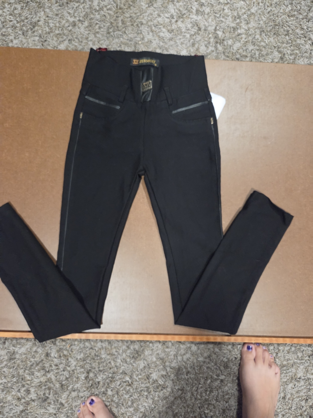 High-Rise Black Skinny Jeans with Zip Pocket Detail